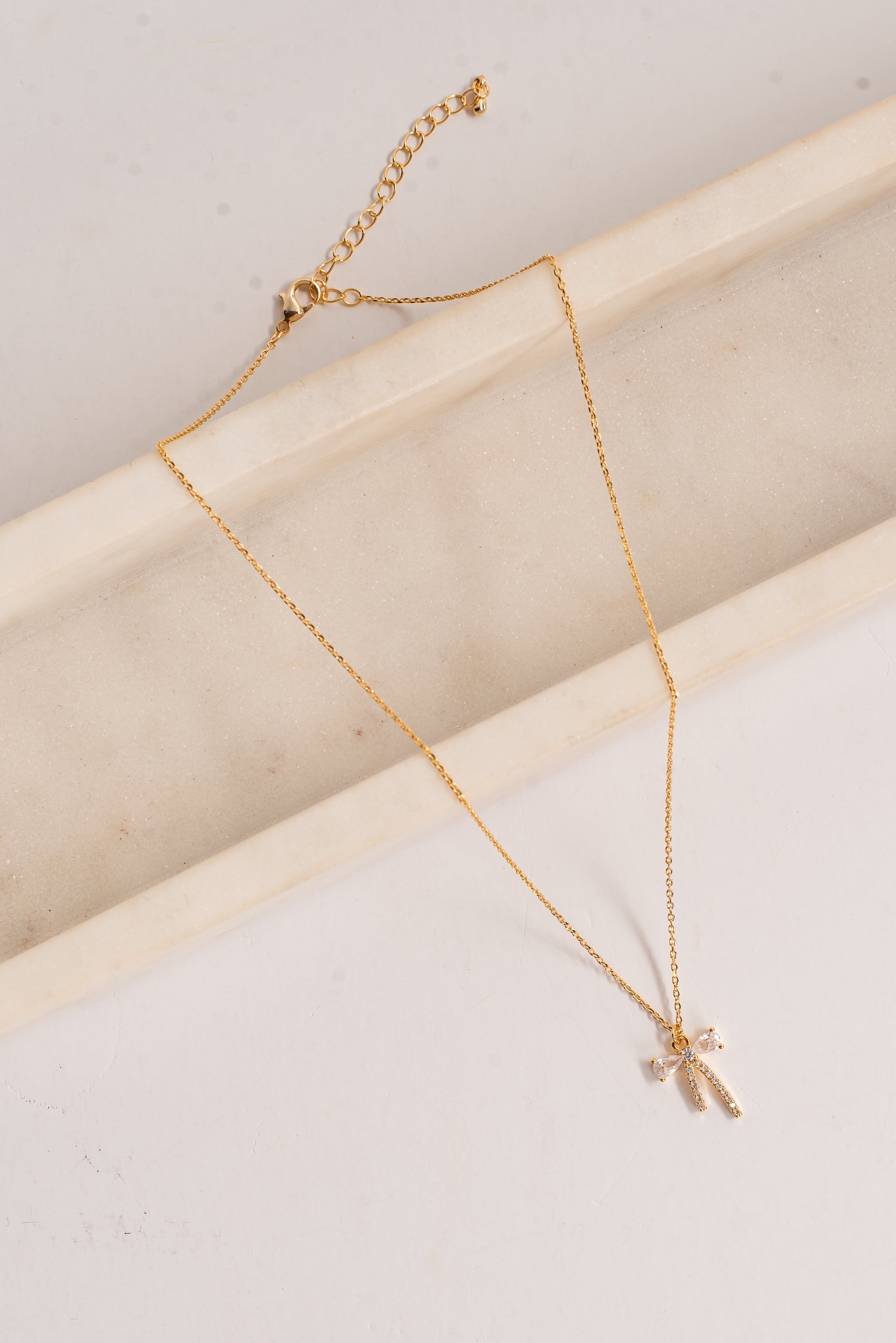 Charlie Gold Rhinestone Bow Charm Necklace