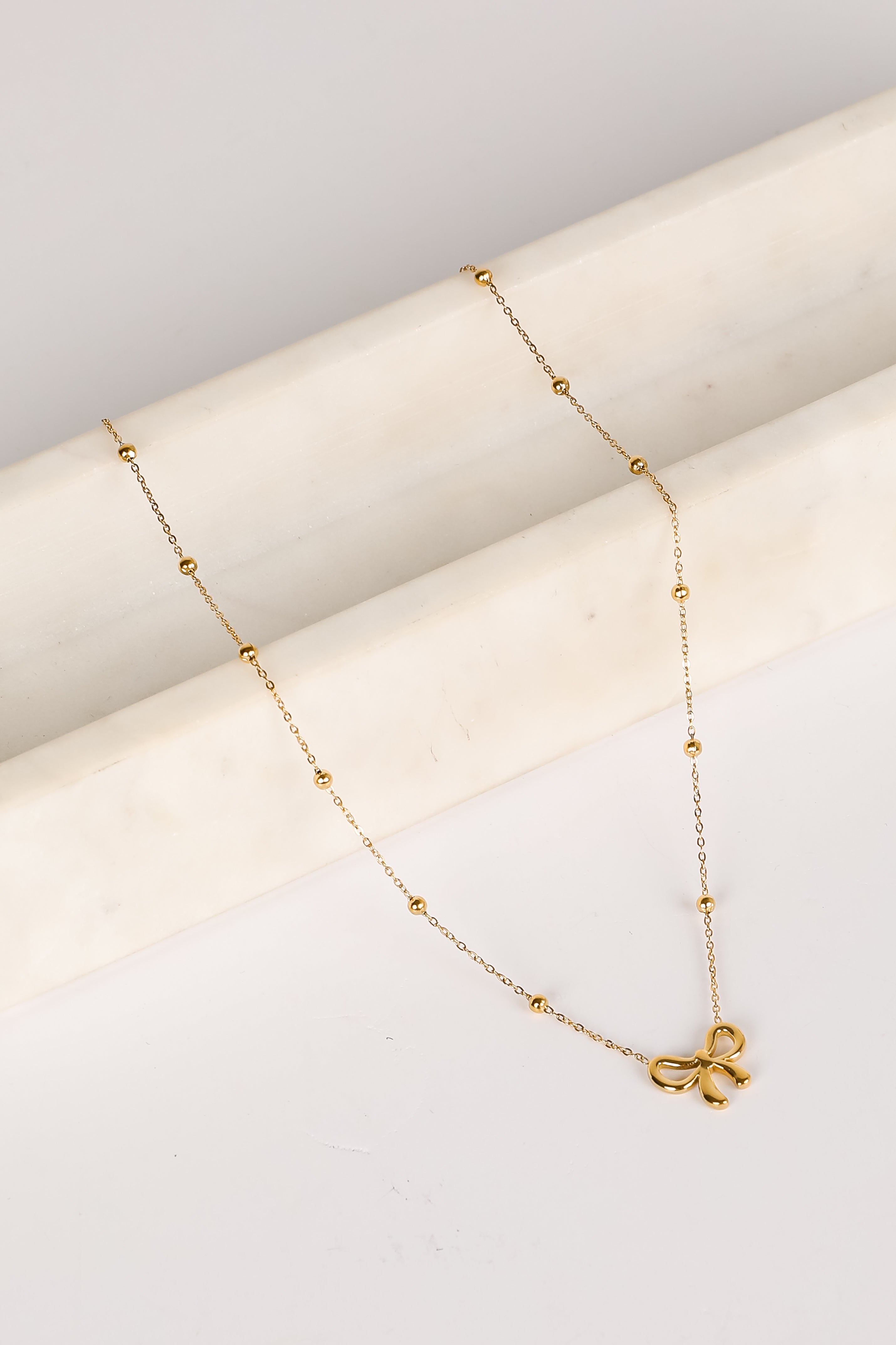 Elizabeth Gold Bow Charm Necklace