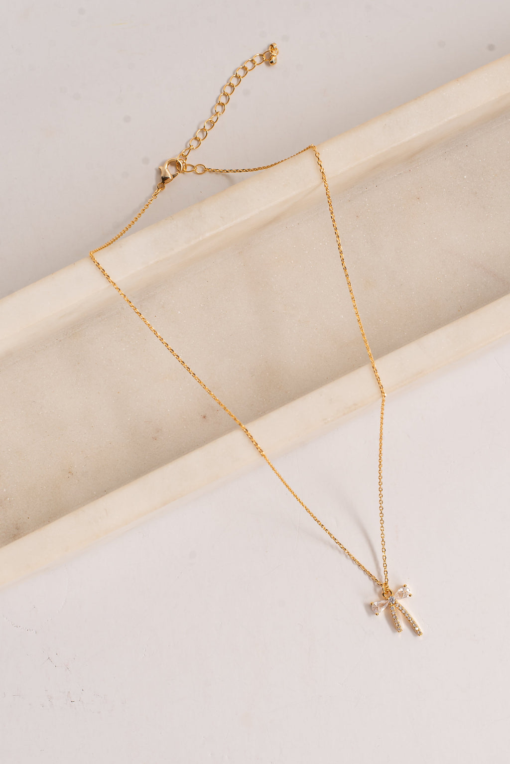 Charlie Gold Rhinestone Bow Charm Necklace